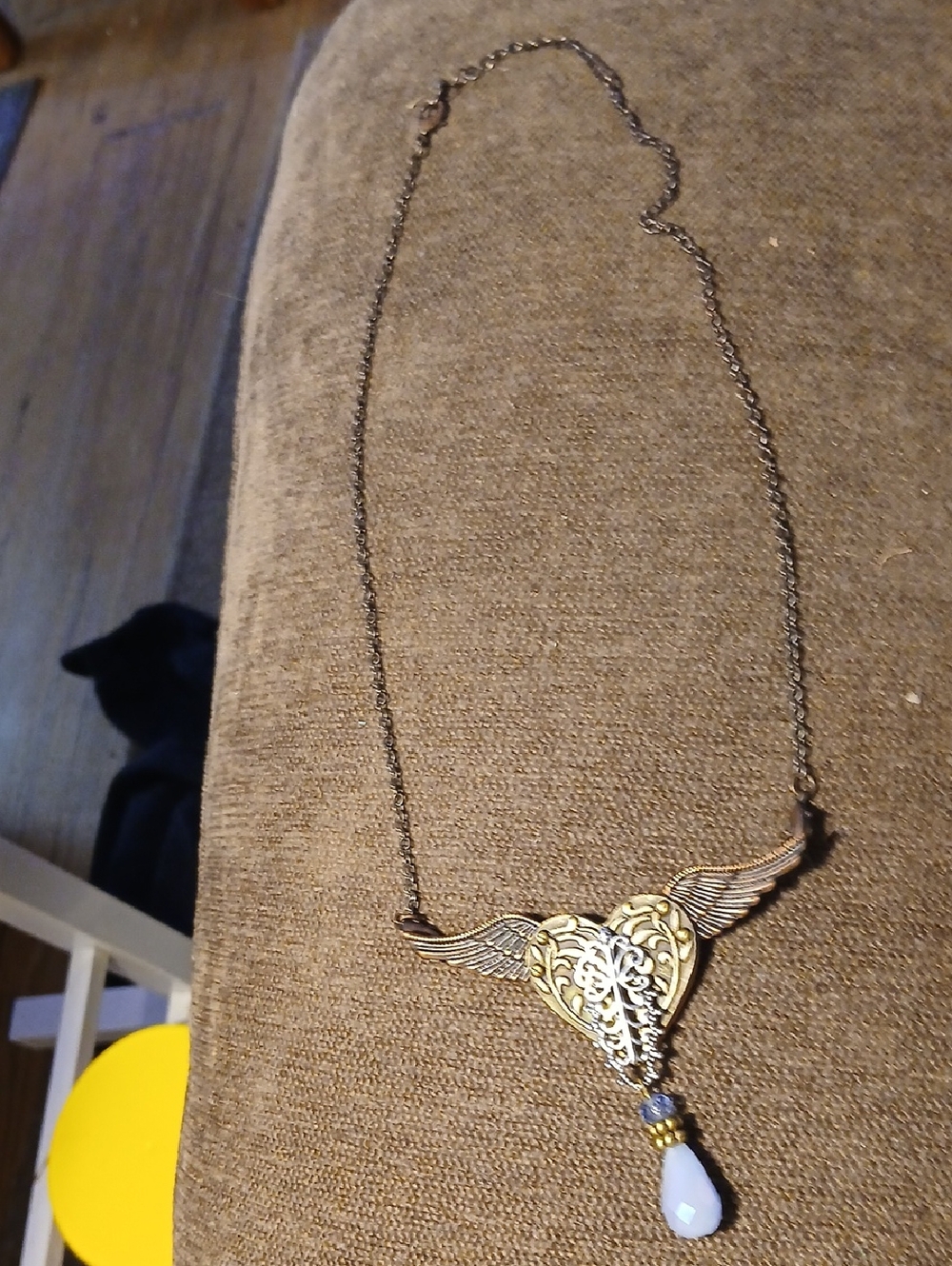 Alexis Gold-Tone Winged Heart Necklace with Blue Teardrop